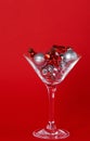 Christmas silver and red toys in a glass goblet Royalty Free Stock Photo