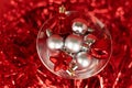 Christmas silver and red toys in a glass goblet Royalty Free Stock Photo