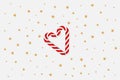 Christmas simple lite background with realistic red and white cane candy forming a heart and golden stars. Xmas holiday cover post Royalty Free Stock Photo