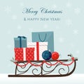 Christmas sleigh filled with gift boxes and shopping bags. Royalty Free Stock Photo