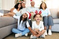 Christmas, smile and portrait of big family on sofa in home living room, bonding and laughing at funny joke. Love, xmas Royalty Free Stock Photo