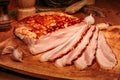 Christmas smoked bacon chopped slices on wooden board with spices.