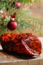 Christmas smoked ham under fir branch