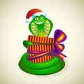 Christmas snake with a gift. Royalty Free Stock Photo