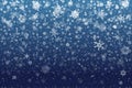 Christmas snow. Falling snowflakes on deep blue background. Snow