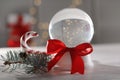 Christmas snow globe with red bow Royalty Free Stock Photo