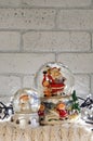 Christmas snow globe with santa claus inside and garland lights Royalty Free Stock Photo