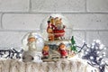 Christmas snow globe with santa claus inside and garland lights Royalty Free Stock Photo