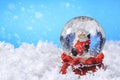 Christmas snow globe on blue background Royalty Free Stock Photo