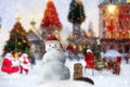 Christmas snow man in red santa hat and holiday  trees decoration on street Tallinn Old town  snowy weather travel to Estonia Euro Royalty Free Stock Photo