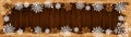 Christmas snow winter background banner panorama - Frame made of snow with snowflakes and ice crystals on brown wooden wood Royalty Free Stock Photo