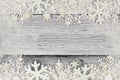 Christmas snowflake double border with snow frame on white wood Royalty Free Stock Photo