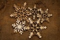 Christmas snowflake shape decoration made wood tree on canvas background Royalty Free Stock Photo