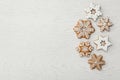 Christmas snowflake shaped cookies on white wooden table, flat lay. Space for text