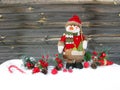 Christmas snowman decoration winter berries and snow on wooden b Royalty Free Stock Photo