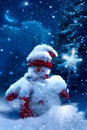 Christmas snowman and fir branches covered with snow Royalty Free Stock Photo