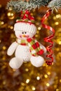 Christmas snowman on fir tree branch