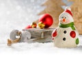 Christmas snowman with presents in winter forest Royalty Free Stock Photo