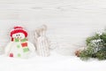 Christmas snowman and sledge toys and fir tree branch Royalty Free Stock Photo