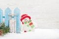 Christmas snowman and sledge toys and fir tree branch Royalty Free Stock Photo