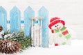 Christmas snowman and sledge toys and fir tree branch Royalty Free Stock Photo