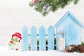 Christmas snowman and sledge toys and fir tree branch Royalty Free Stock Photo