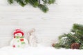 Christmas snowman and sledge toys and fir tree branch Royalty Free Stock Photo