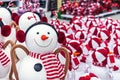 Christmas snowman toy with a striped red scarf