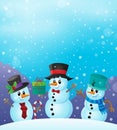 Christmas snowmen in snowy weather