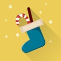 Christmas sock with candies icon with long shadow.