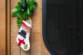 Christmas sock hang on the wood door waiting for Santa`s gift Royalty Free Stock Photo