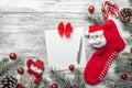 Christmas sock with presents. Christmas decoration stocking and toys hanging over gray rustic wooden background. Royalty Free Stock Photo