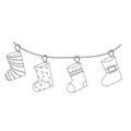 Christmas sock set for gifts on a string in line style. Vector illustration Royalty Free Stock Photo