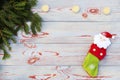Christmas sock on wooden background. Toy and Christmas stocking, there is a branch of fir. Christmas and New Year decorations. Royalty Free Stock Photo