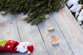 Christmas sock on wooden background. Toy and Christmas stocking, there is a branch of fir. Christmas and New Year decorations. Royalty Free Stock Photo