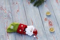 Christmas sock on wooden background. Toy and Christmas stocking, there is a branch of fir. Christmas and New Year decorations. Royalty Free Stock Photo