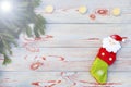 Christmas sock on wooden background. Toy and Christmas stocking, there is a branch of fir. Christmas and New Year decorations. Royalty Free Stock Photo