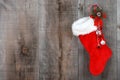 Christmas sock and wreath on wood Royalty Free Stock Photo