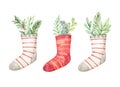 Christmas socks with greenery, eucalyptus, fir branches. Watercolor illustration. Happy new year. Winter design elements. Perfect