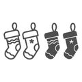 Christmas socks line and glyph icon. Two stuffer socks vector illustration isolated on white. Christmas stocking outline