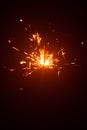 Christmas sparkler in haze with red light Royalty Free Stock Photo