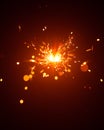 Christmas sparkler in haze with red light Royalty Free Stock Photo