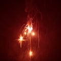 Christmas sparkler with red light Royalty Free Stock Photo