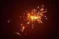 Christmas sparkler with red light Royalty Free Stock Photo