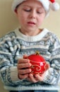 Christmas sphere in child hands