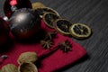 Christmas spices and a beautiful Merry Christmas bauble. Close up Christmas decoration on table Royalty Free Stock Photo