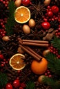 Christmas spices, fruit pieces, baubles, seeds and leaves abstract background. Royalty Free Stock Photo