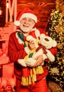 Christmas spirit. Bearded grandfather senior man celebrate christmas. Kind grandpa with soft toys. Christmas decoration