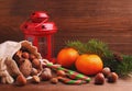 Christmas spirit: nuts, tangerines, Christmas tree, nuts, a flashlight Royalty Free Stock Photo