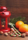 Christmas spirit: nuts, tangerines, Christmas tree, nuts, a flashlight Royalty Free Stock Photo